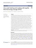 City-scale heating and cooling with aquifer thermal energy storage (ATES)