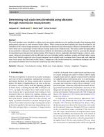 Determining rock crack stress thresholds using ultrasonic through-transmission measurements