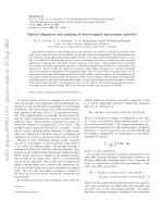 Optical alignment and spinning of laser-trapped microscopic particles