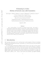 Swimming in circles: Motion of bacteria near solid boundaries