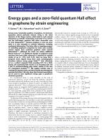 Energy gaps and a zero-field quantum Hall effect in graphene by strain engineering