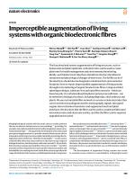 Imperceptible augmentation of living systems with organic bioelectronic fibres