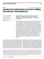 Atomic-level polarization reversal in sliding ferroelectric semiconductors