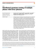 Distributed quantum sensing of multiple phases with fewer photons